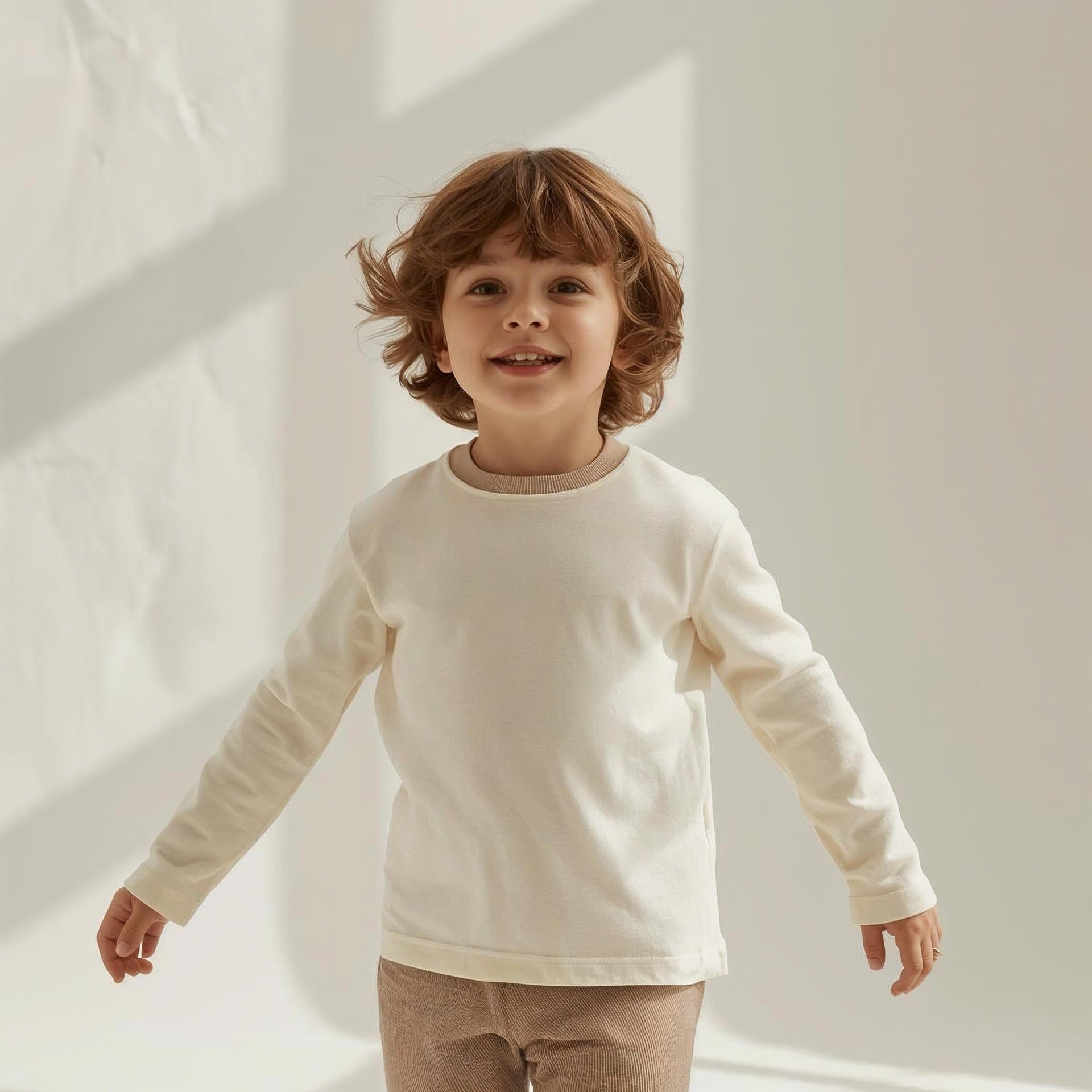 Explore minimal kids’ long-sleeve tops with soft fabrics and clean designs. Ideal for layering, casual outfits, and comfortable all-day wear.