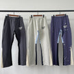 Nameria Men’s Splatter Ink Patchwork Flared Sweatpants